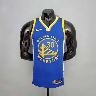 A blue basketball jersey numbered 30 fitted on a black mannequin torso against a grey wall